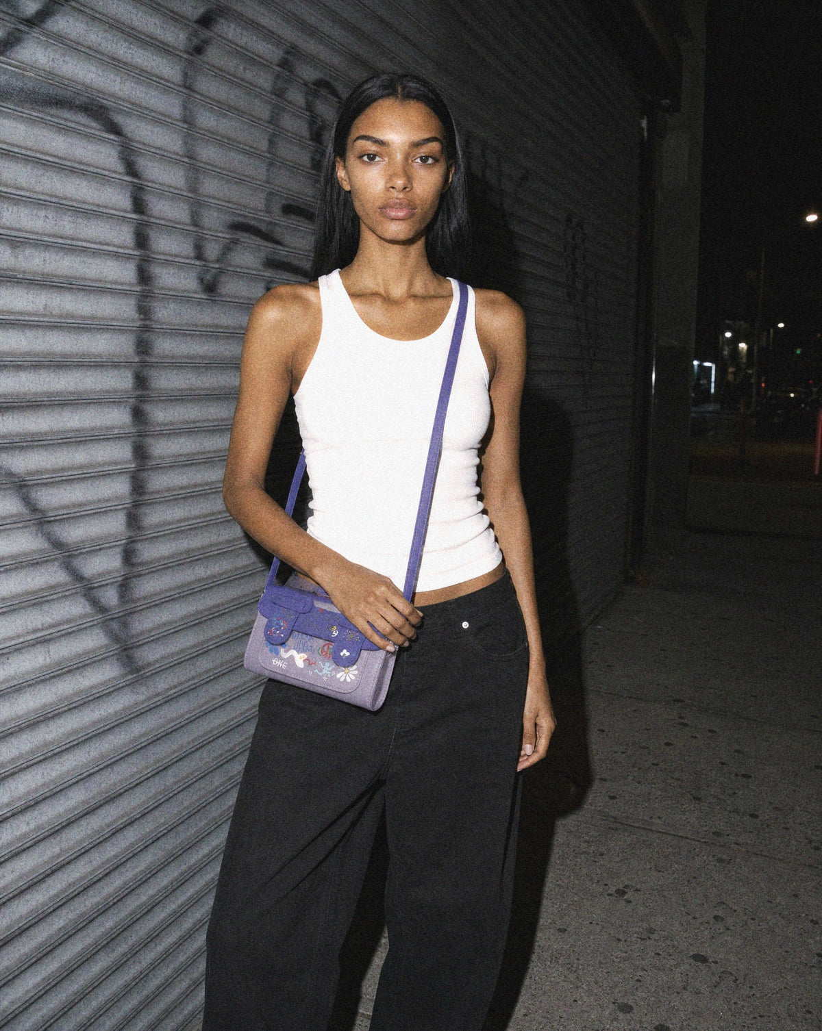 Mini Graffiti Crossbody editorial — black graffiti crossbody bag by Sulta Studios
